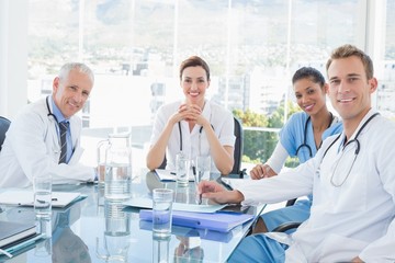 Team of smiling doctors having a meeting