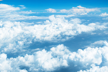 Naklejka na ściany i meble Aerial view of Blue sky and Cloud Top view from airplane window,