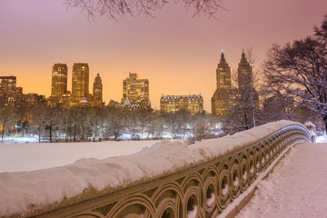 Fototapeta na wymiar Central Park - New York City bow bridge after snow storm