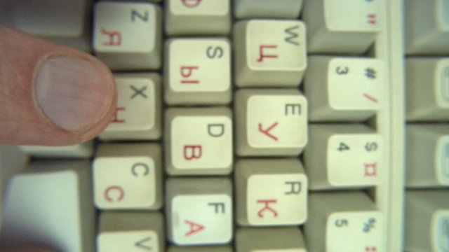 Human fingers typing text on keyboard