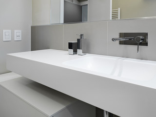 foreground of a washbasin in modern bathroom