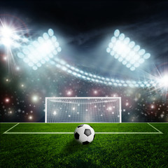 Soccer ball on green stadium arena
