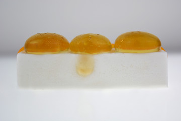 Molecular cuisine, milk curds with molecular honey spheres.