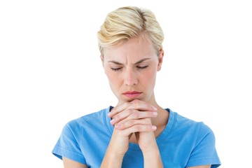 Pretty blond woman praying