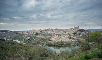 Fototapeta na wymiar Wide angle view of Toledo with cloudy sky