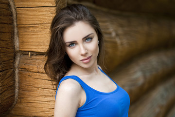 Sexy young woman, against the background of the old wooden board