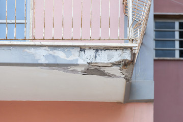 Balconies with cracked concrete requiring renovation