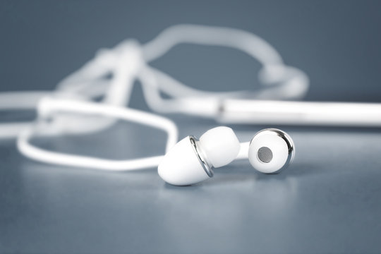 selective focus of white earphones for using with digital music