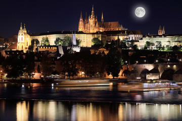 Fototapeta na wymiar Night Prague gothic Castle with the Moon, Czech Republic