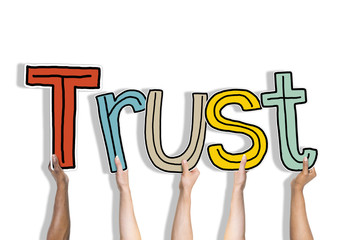 Diverse Hands Holding the Word Trust Concept