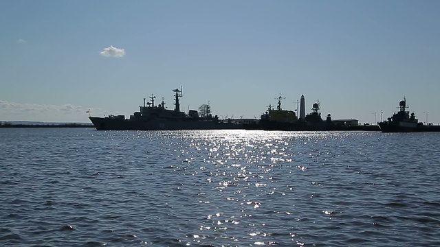 Silhouette row of warships in the Bay of Kronstadt 