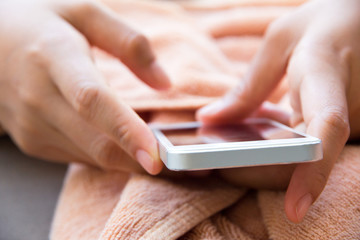 Close up image of Teenage girl text messaging on her phone