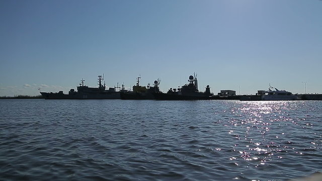 Silhouette row of warships in the Bay of Kronstadt 