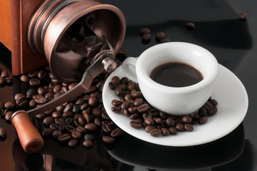 white cup with old Neapolitan grinder coffee