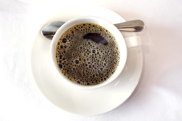 Overhead view of a freshly brewed mug of black coffee