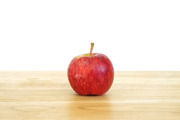 Red apple on wood table
