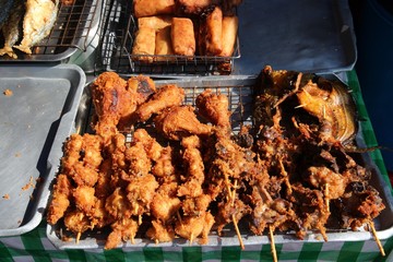 Thai street food - battered chicken on stick