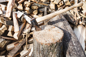 wood cleaver ax in deck for chopping firewood