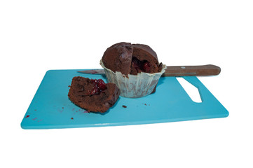 chocolate cupcake on blue