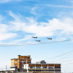 military aircrafts flight over urban house