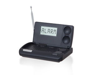 Old digital radio alarm clock isolated on white