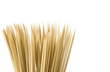 Bunch of wooden skewers on a white background