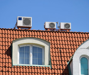 Air conditioners on the top of a building