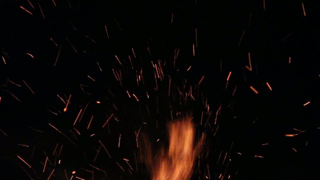 Huge sparks, flying from a fire