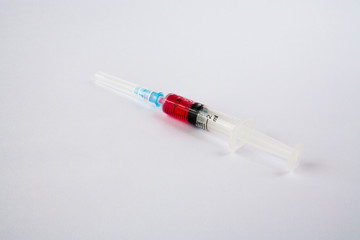 syringe with red liquid