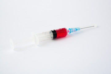 Fototapeta premium syringe with red liquid