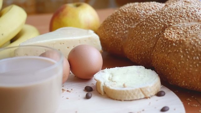 Slowmotion. Healthy breakfast on the table close up with cup of