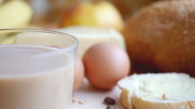 Slowmotion. Healthy breakfast on the table close up with cup of