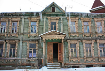 Old russian wooden house with platbands