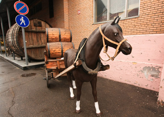 Horse carrying a barrel of beer