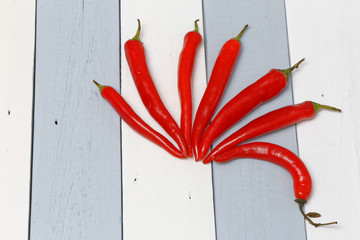Red Hot Peppers on the Wooden Table