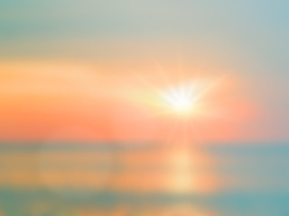 Fototapeta premium Blurred nature background. Sandy beach backdrop with turquoise w