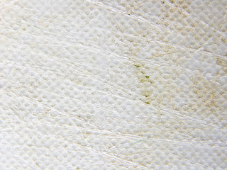Close up of plastic chopping board with deep scratch by knife