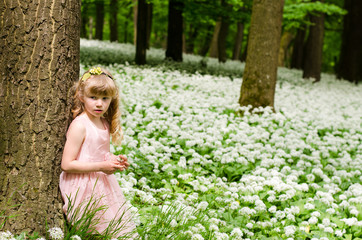 blond girl in spring woods