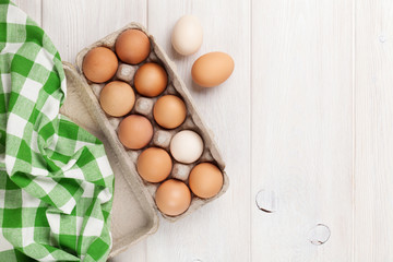 Cardboard egg box on wooden table