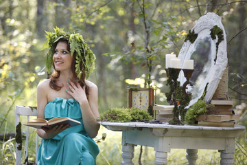 Naklejka premium Beautiful model in the woods in a vintage scenery