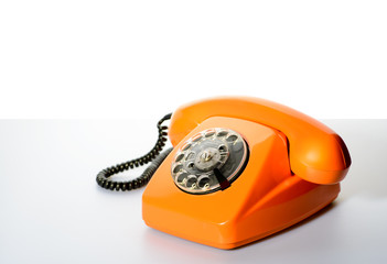 Vintage phone on a white table