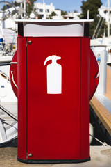 Fire hidrant in the port next to yatchs