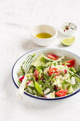 vegetable salad with pasta in a vintage plate 