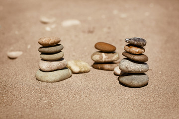 Fototapeta na wymiar zen stones on beach Stones balance spa wellness 
