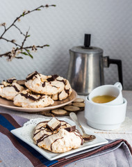 vanilla meringue with chocolate, caramel and nuts, sweet cake, a