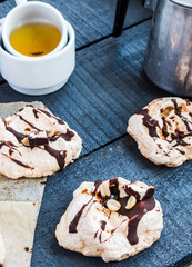 vanilla meringue with chocolate, caramel topping and nuts, sweet