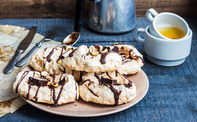 vanilla meringue with chocolate, caramel topping and nuts, sweet