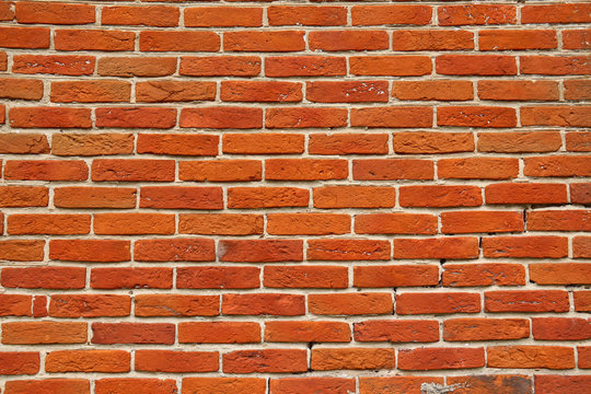 Wall of orange annealed bricks