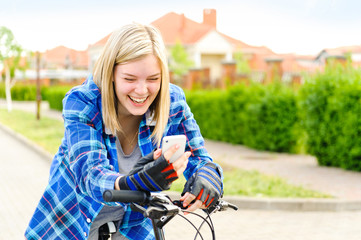 Young woman with bicycle in a park - outdoor