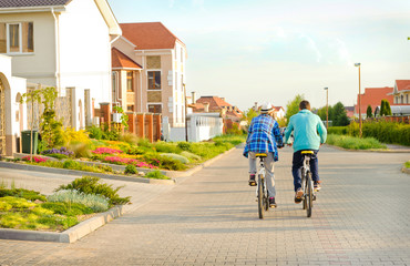 Obraz premium Couple of cyclists riding bicycles .